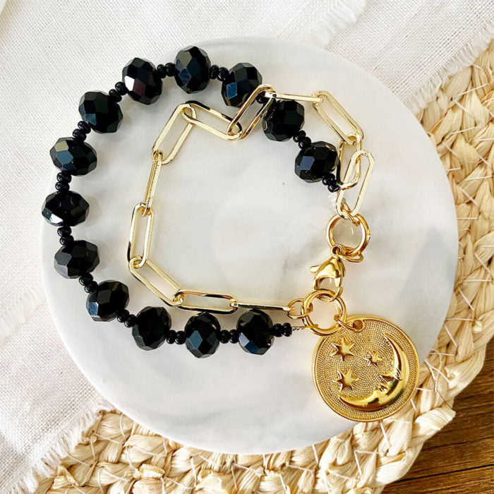 Pulsera negra doble con luna dorada