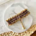 Pulsera Destellos de Miyuki morada tejida a mano