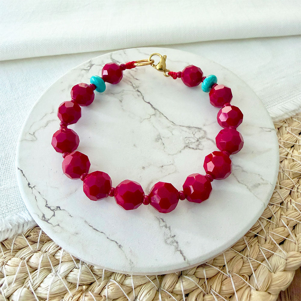 Detalle de la Pulsera Oria Rojo y Turquesa